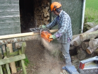  length of timber screwed to top of log to provide straight guide
